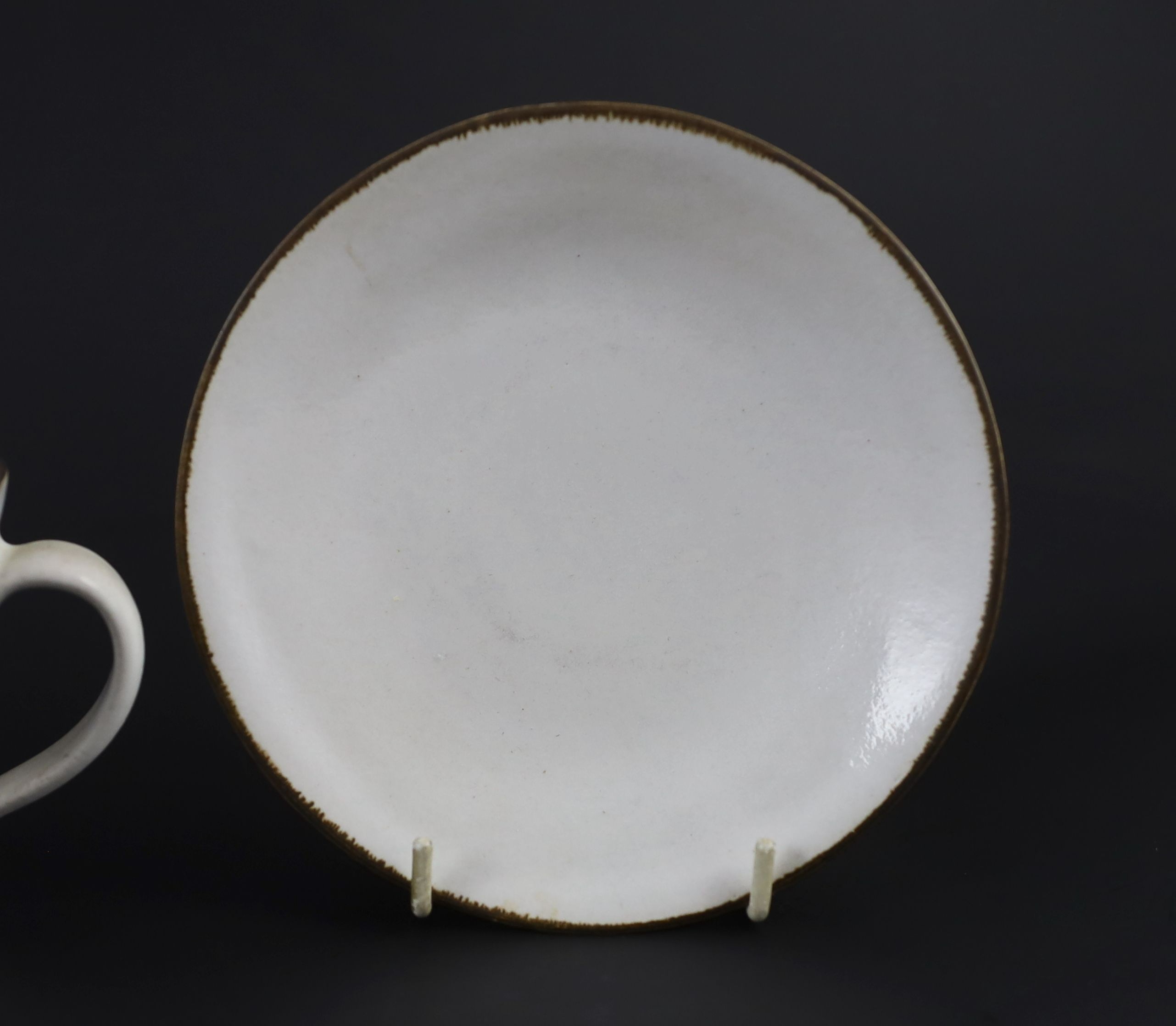 Dame Lucie Rie (1902-1995) a cup, saucer and side plate, c.1959, Cup 8 cm high